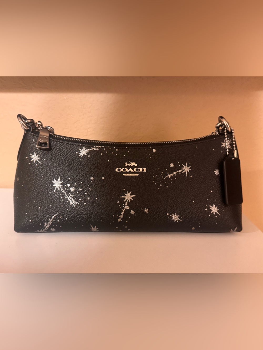Coach Black Leather Star-Print Wristlet with Silver Accents